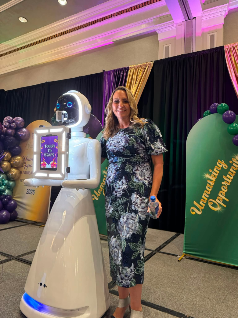 The roaming robot photo booth with a lit touchscreen at a ballroom event
