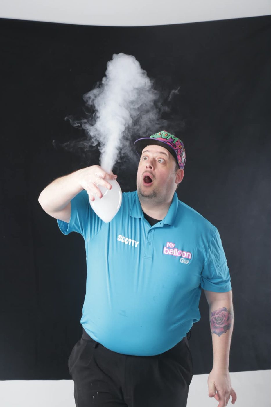 A smoke-filled bubble bursting into a plume in Scotty's hand